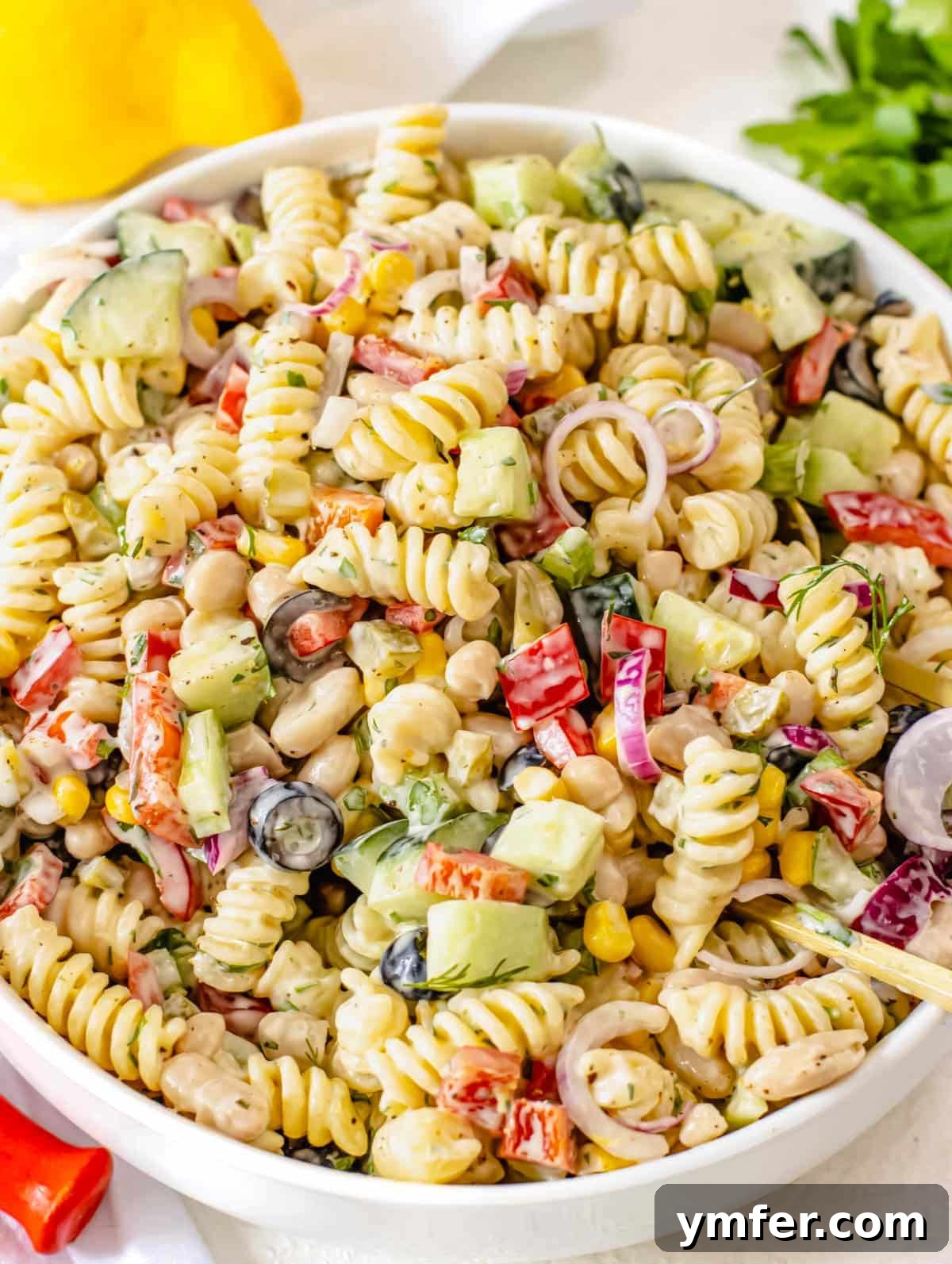 Velvety Pasta Salad 2 Creamy pasta salad ready to be served, featuring pasta, fresh vegetables, and a rich, creamy dressing.