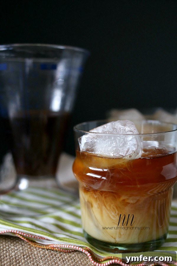 Exotic Cardamom Coconut Iced Coffee 4 Three glasses of Cardamom Coconut Milk Iced Coffee, showcasing the layers of coffee and creamer, with the focus on the inviting texture and garnish.
