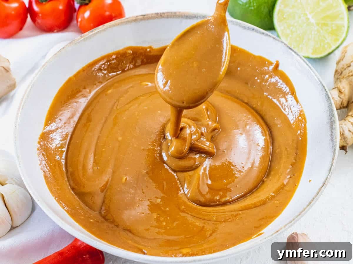 Delicious Peanut Sauce 10 Creamy peanut sauce and a silver spoon