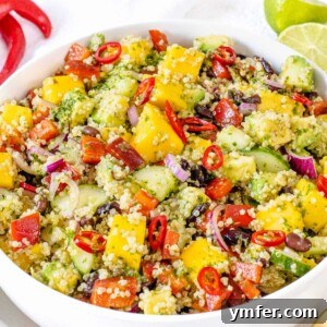 Black Bean Mango Quinoa Salad with chili and lime garnish