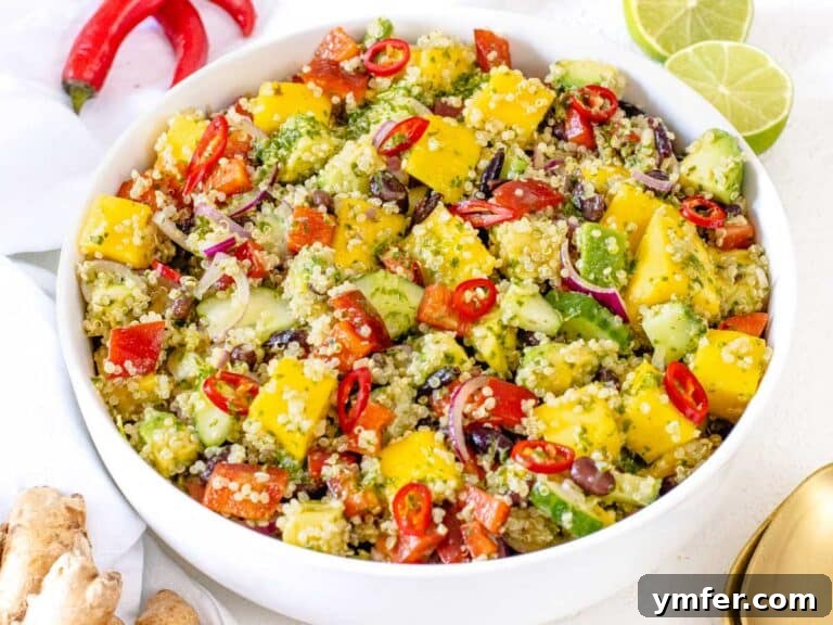 Black Bean Mango Quinoa Salad tossed with dressing