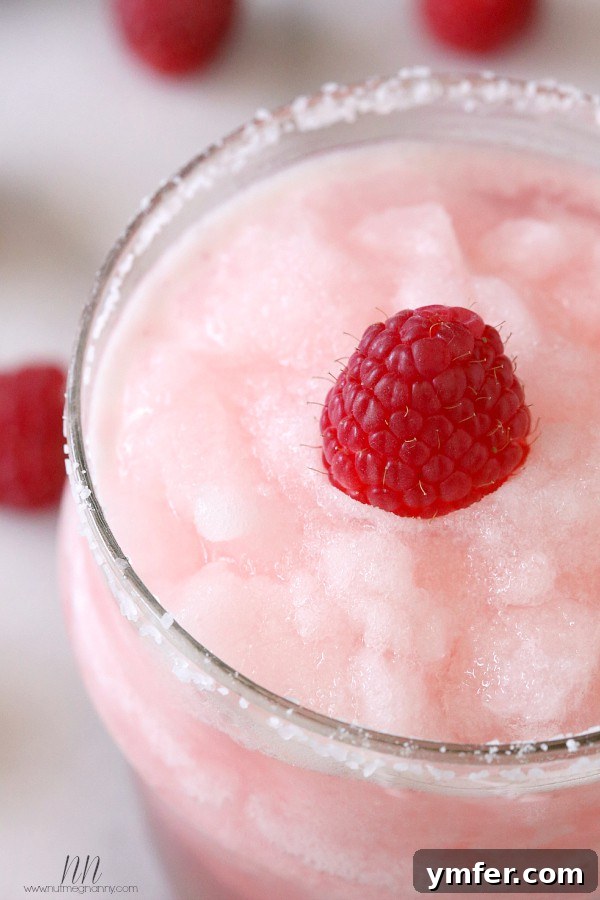Raspberry Acai Frozen Margarita by Nutmeg Nanny Delicious Raspberry Acai Frozen Margarita, ready to be served