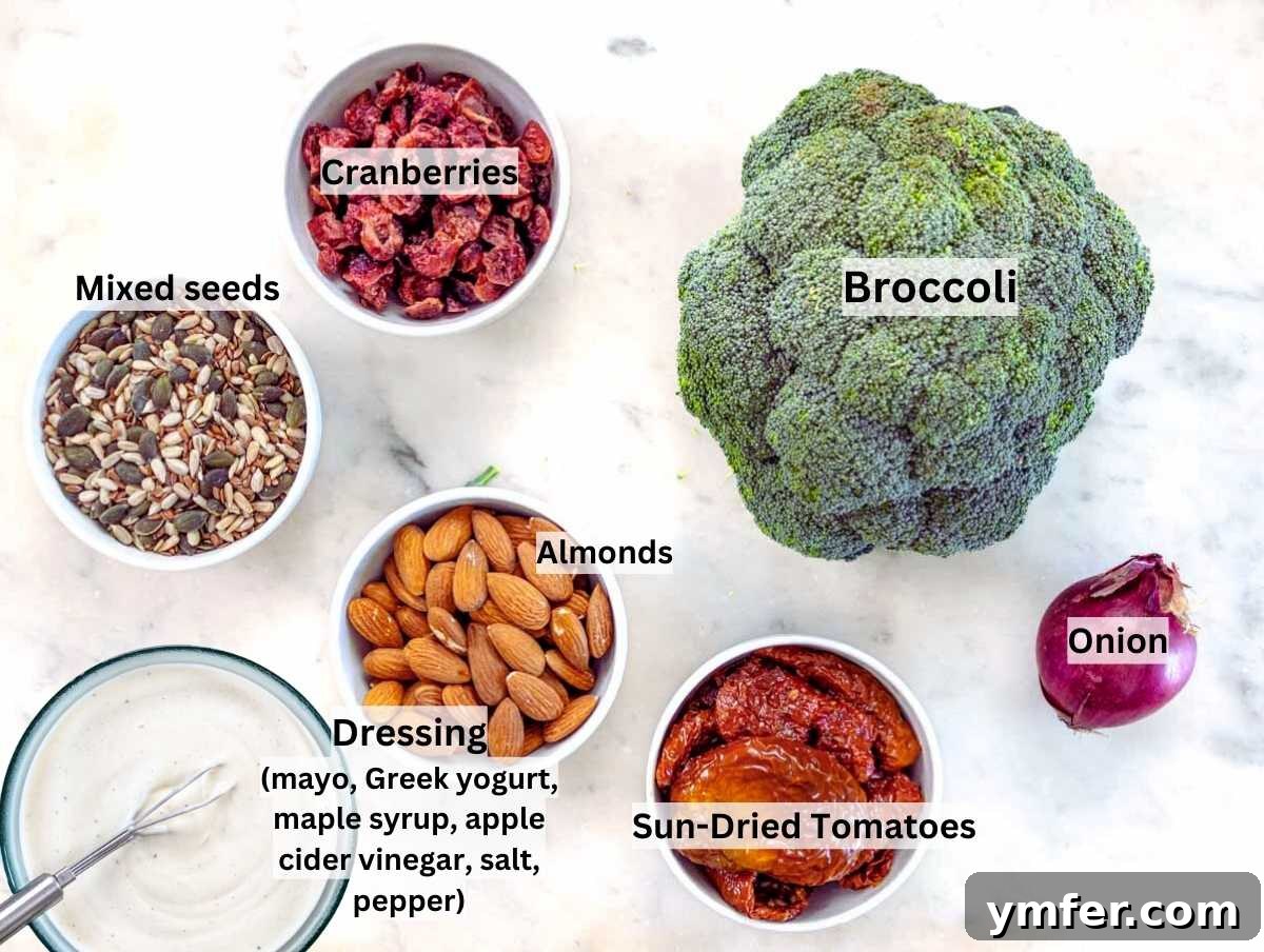 Creamy Broccoli Delight 3 Ingredients for broccoli salad laid out on a marble table.