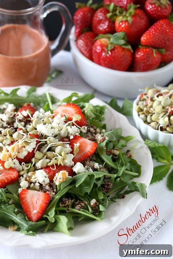 Summer Strawberry Chevre Quinoa Bowl 2 A beautifully presented Strawberry Goat Cheese Quinoa Salad by Nutmeg Nanny, showcasing fresh ingredients.
