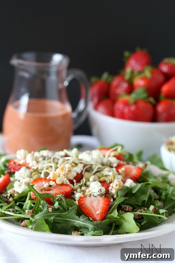 Summer Strawberry Chevre Quinoa Bowl 4 A delectable serving of Strawberry Goat Cheese Quinoa Salad, featuring goat cheese crumbles on top.