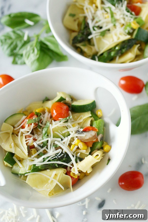 Spring Vegetable Pappardelle A bowl of Spring Vegetable Pappardelle with a fork, ready to eat