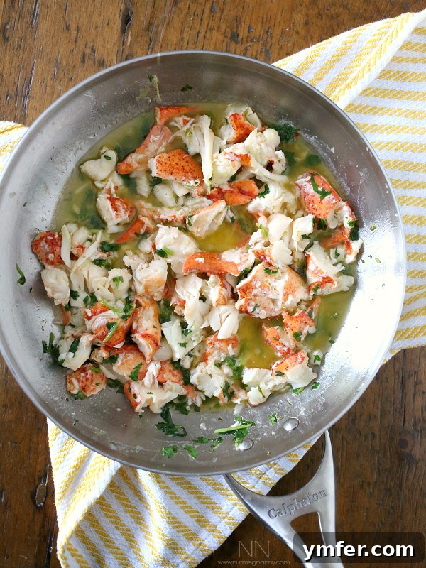 Buttery Warm Lobster Roll 5 Hot Lemon Cilantro Buttered Lobster Roll, ready to serve
