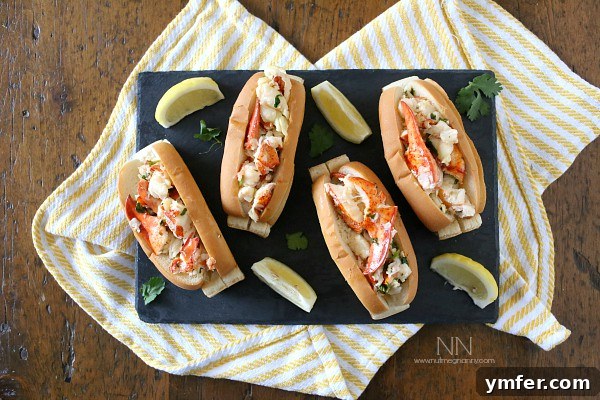 Buttery Warm Lobster Roll 7 Connecticut Style Hot Lemon Cilantro Butter Lobster Roll Recipe with a side