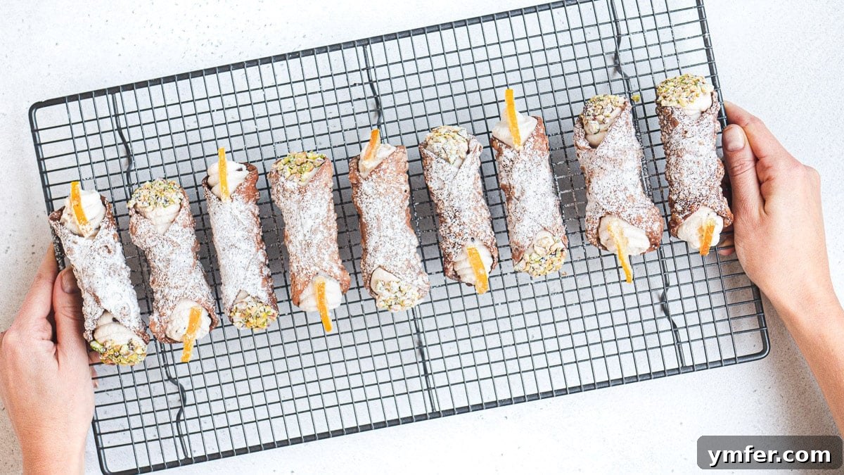 A plate of freshly prepared vegan cannoli, garnished and ready to eat.