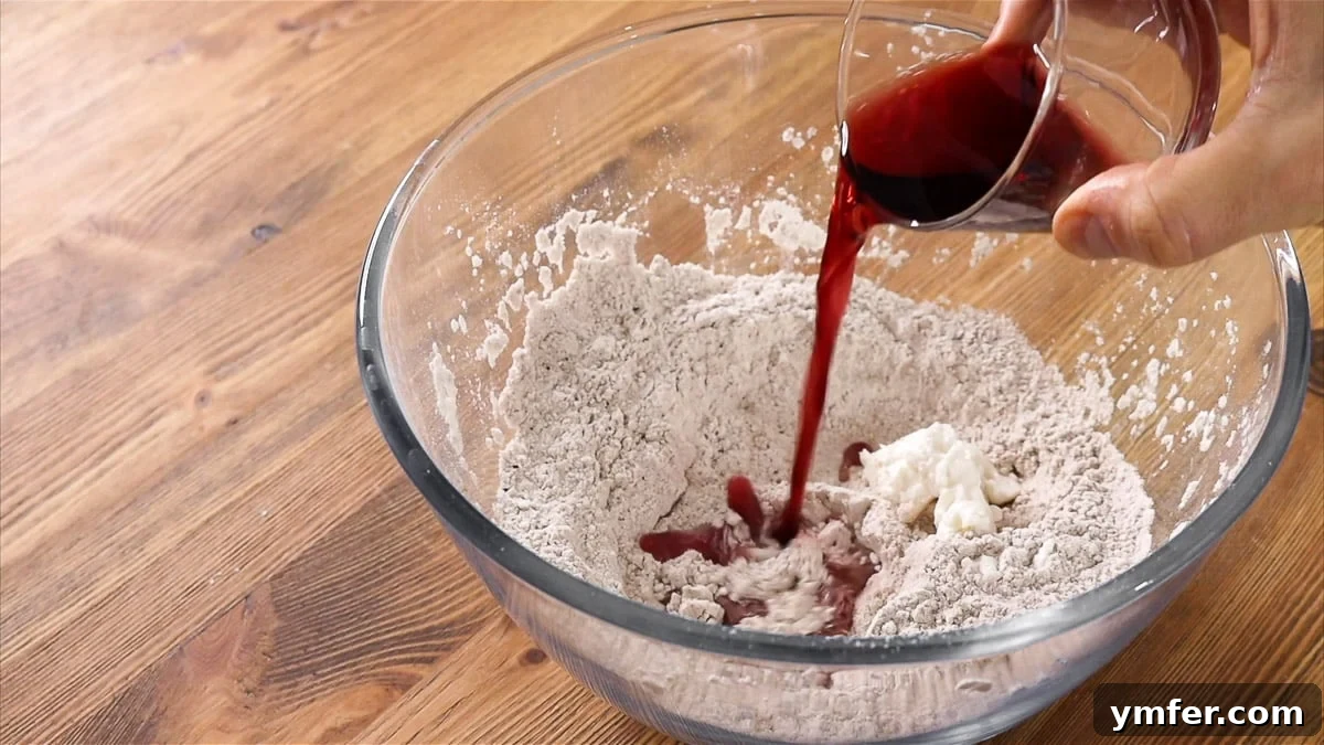 Mixing the cannoli dough ingredients in a bowl.