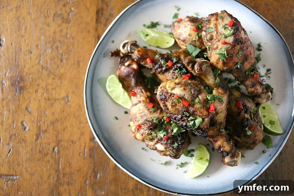 Authentic Jamaican Jerk Chicken 3 Close-up of marinated Jamaican Jerk Chicken drumsticks before grilling