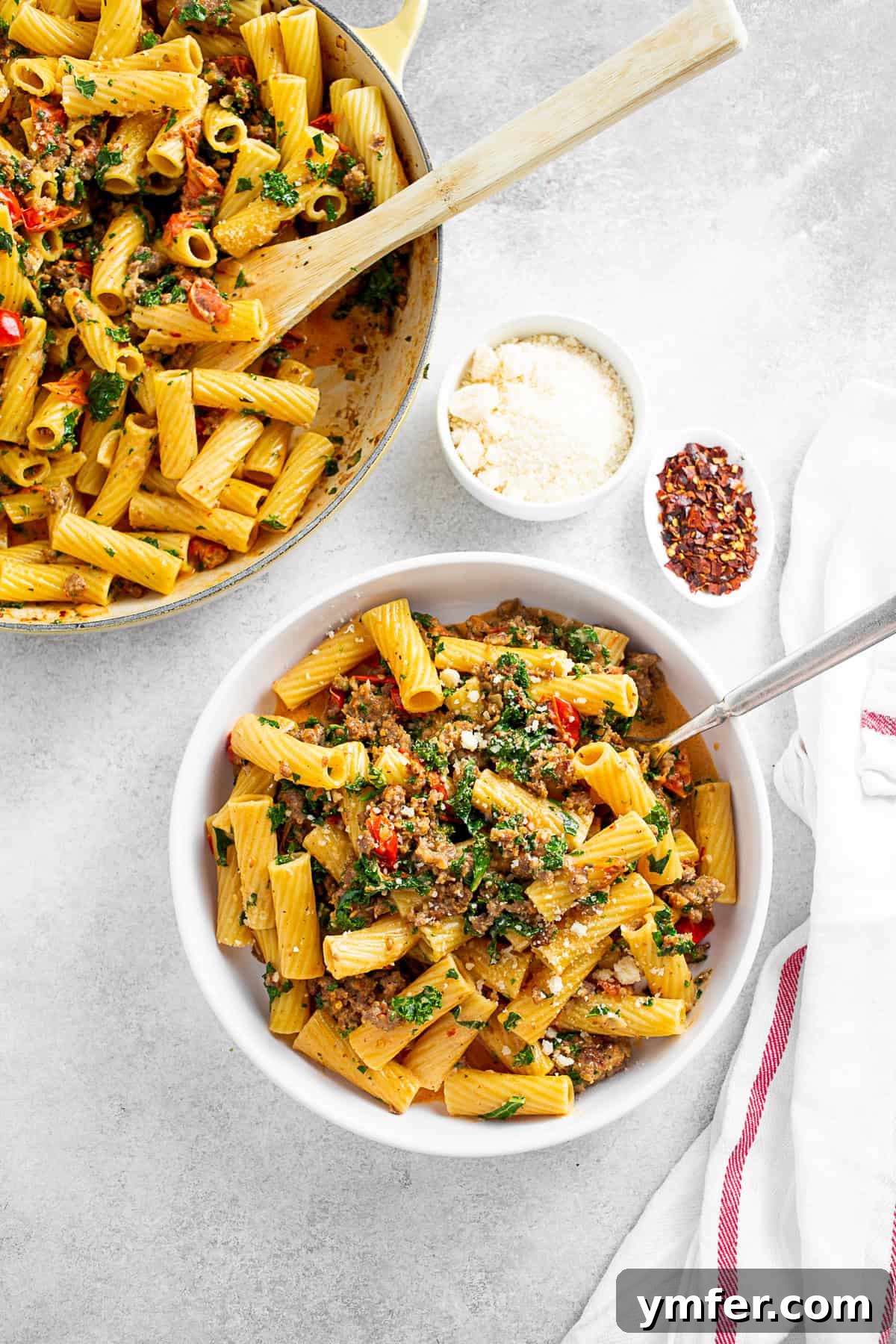 Italian Sausage Kale Pasta served with Parmesan cheese and crushed red pepper. 
