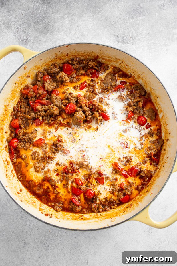 Heavy cream mixed in with Italian sausage and tomatoes. 