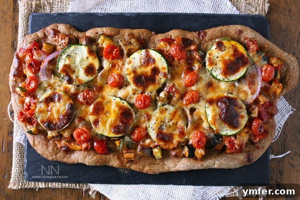 Provencal Garden Pizza 4 A Ratatouille Pizza generously topped with fresh vegetables and glistening melted mozzarella cheese, fresh out of the oven.