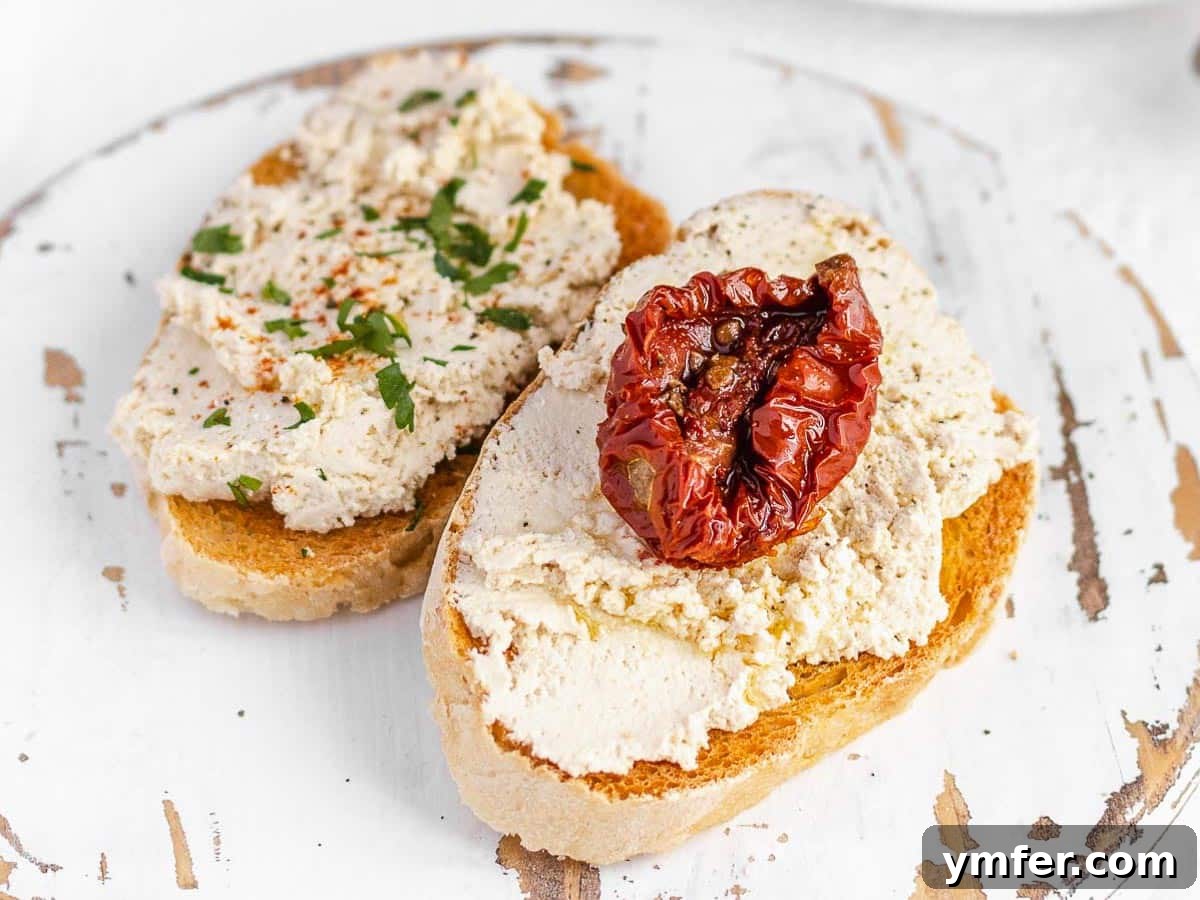 Creamy Vegan Ricotta 16 Crispy crostini topped with a generous dollop of vegan ricotta and fresh herbs, perfect as an appetizer.