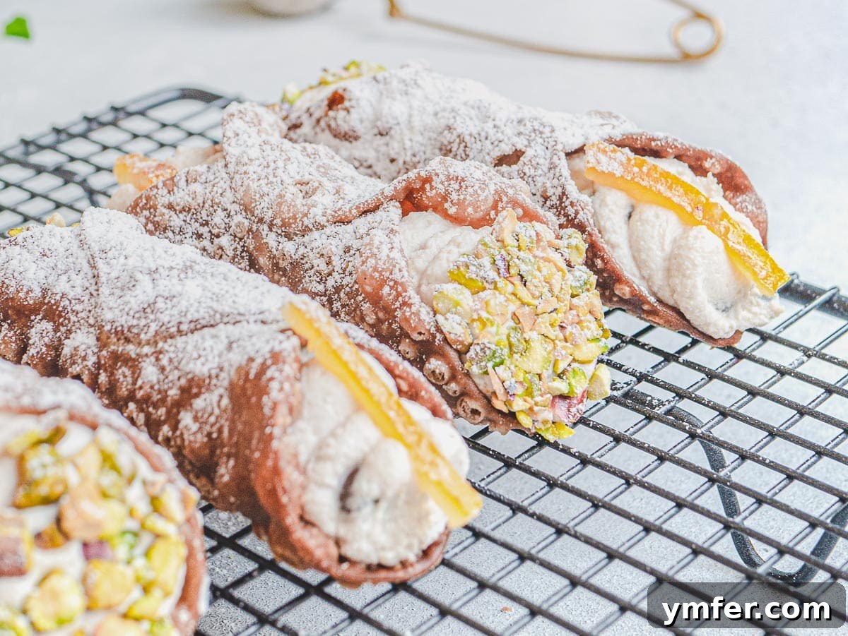Creamy Vegan Ricotta 21 Delicate vegan cannoli resting on a cooling rack, showcasing their sweet ricotta filling.