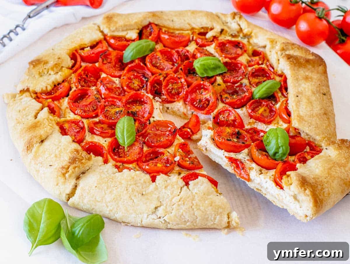 Creamy Vegan Ricotta 24 A delicious slice of tomato galette topped with creamy vegan ricotta, illustrating its use in savory baking.