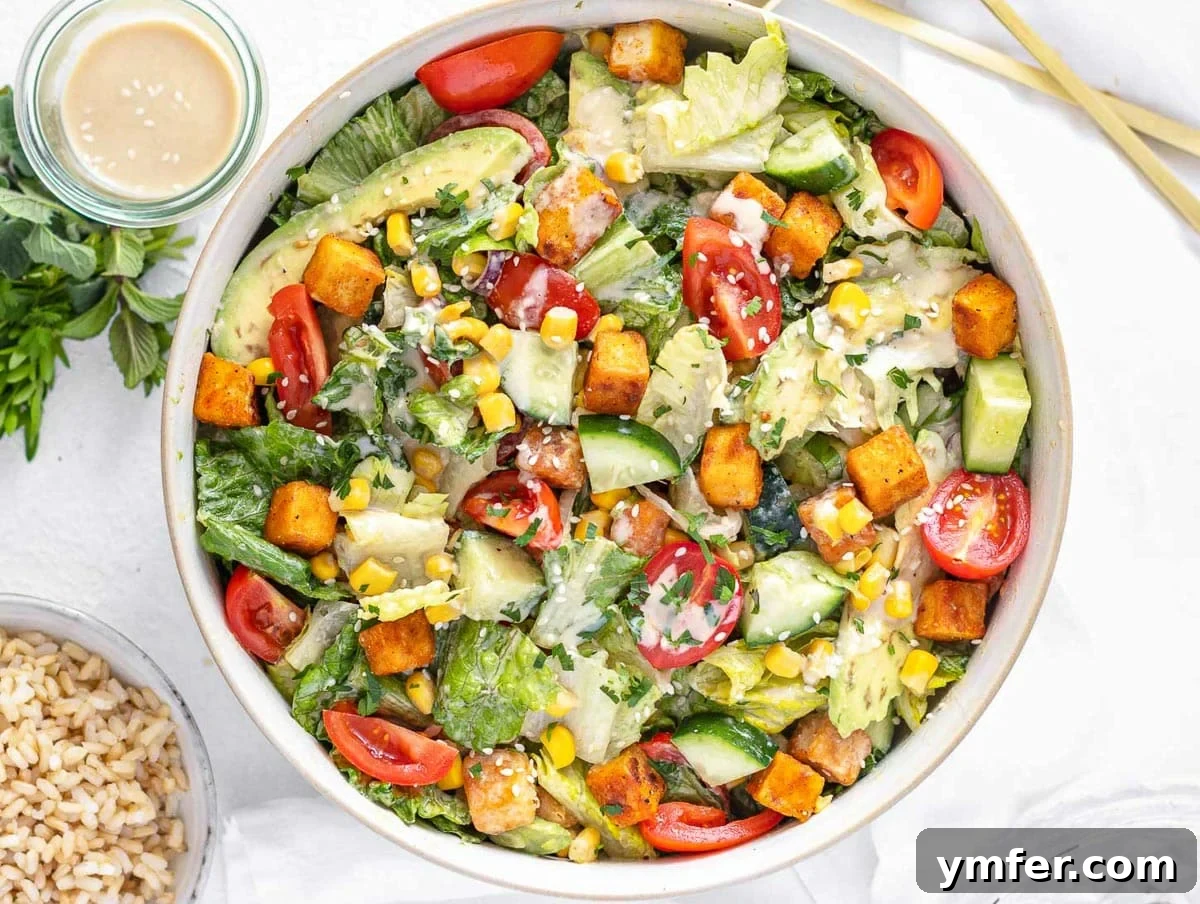 Nourishing Plant Power Meals 11 Vibrant tofu salad served with a creamy tahini dressing