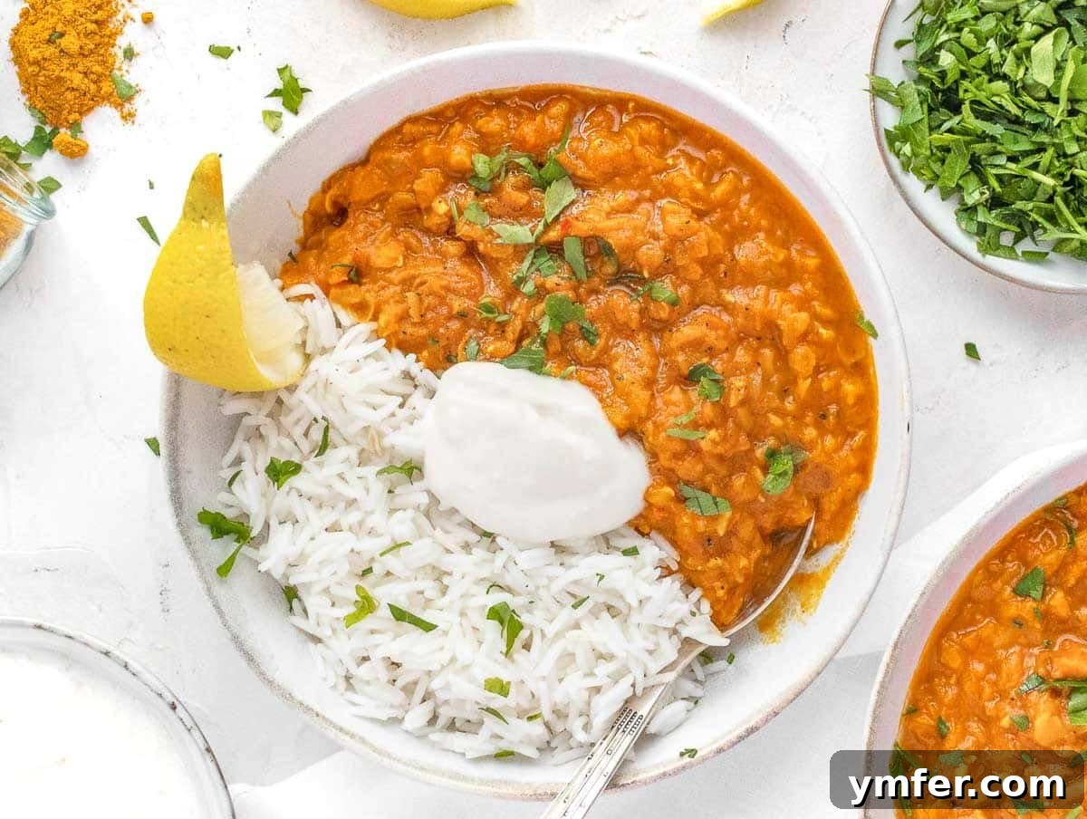 Nourishing Plant Power Meals 13 Rich lentil curry served with basmati rice and a dollop of yogurt