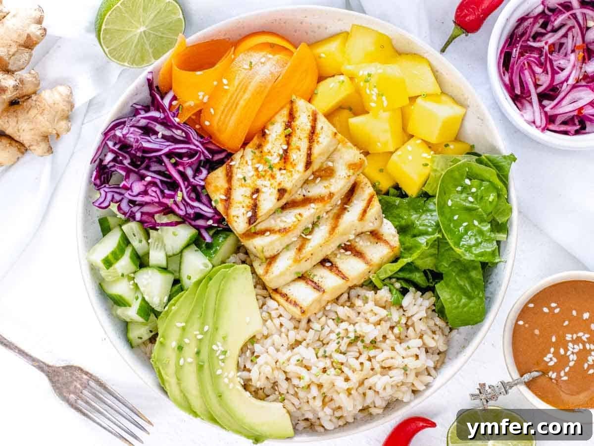 Nourishing Plant Power Meals 24 Colorful Buddha bowl featuring brown rice, mango, and various plant-based components
