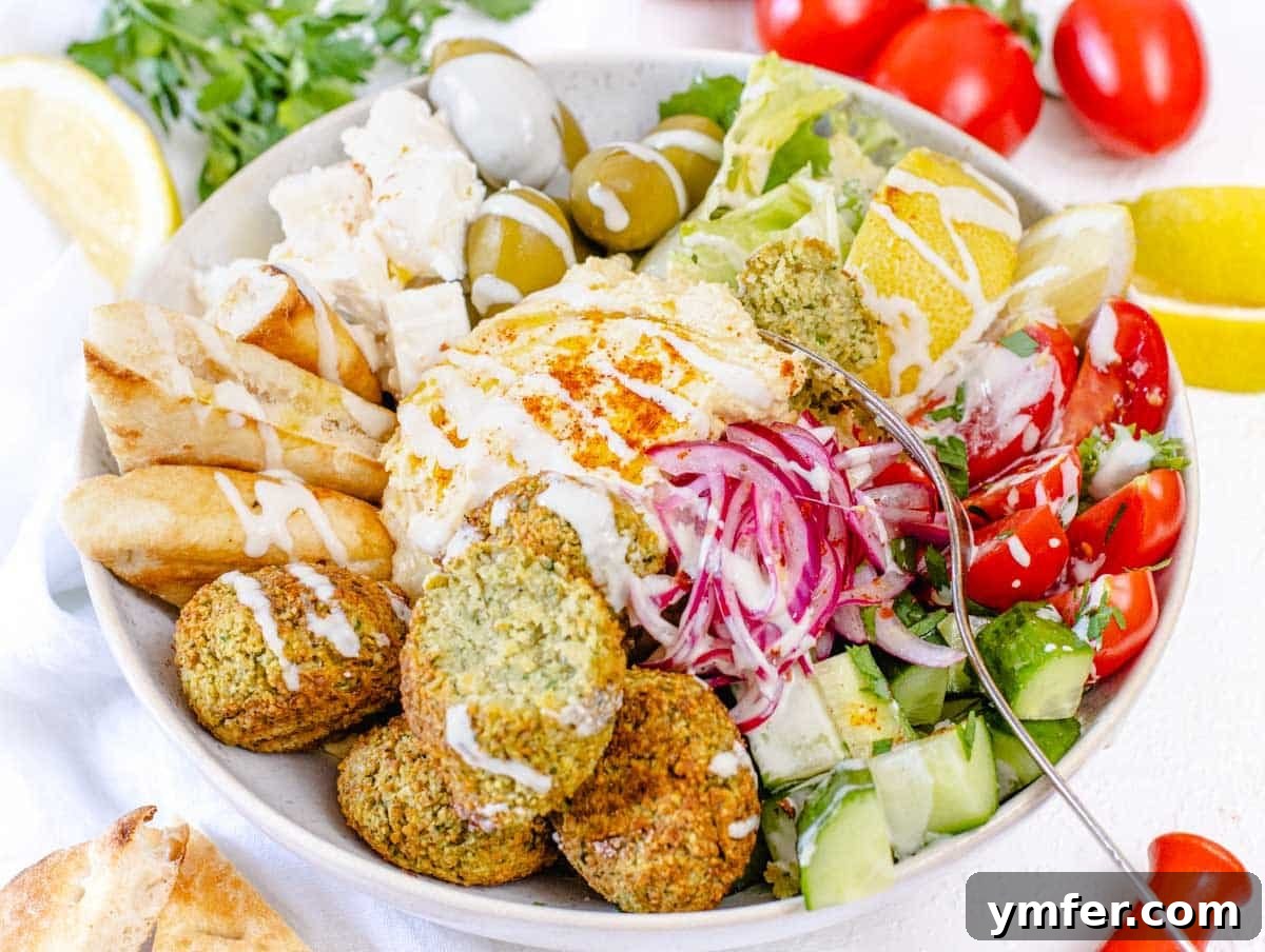 Nourishing Plant Power Meals 32 Fresh Mediterranean bowl drizzled with tahini sauce