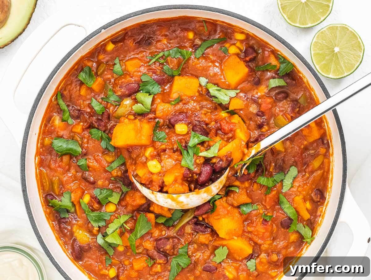 Nourishing Plant Power Meals 40 Hearty sweet potato chili simmering in a Dutch oven, perfect for a healthy vegetarian meal