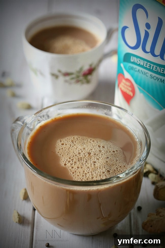 Homemade Vegan Chai Latte Comfort A second inviting image of the dairy-free, vegan soy chai tea latte, highlighting its frothy texture and inviting warmth, perfect for a cozy moment.