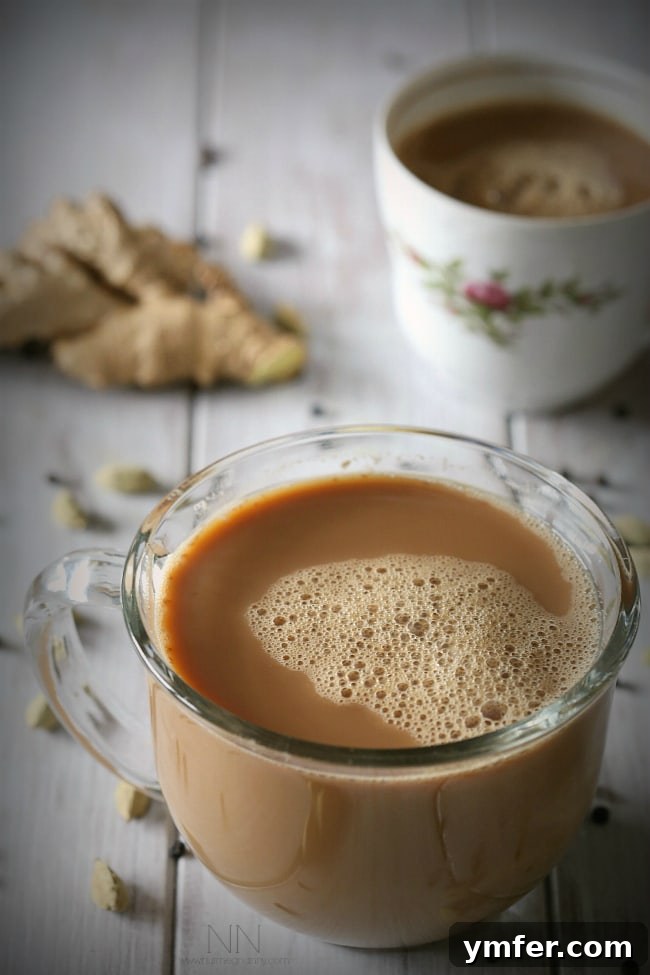 Dairy-Free Chai: A Cozy Treat A close-up of the dairy-free, vegan soy chai tea latte, showing the steam rising from the cup, emphasizing its warmth and inviting flavor profile.