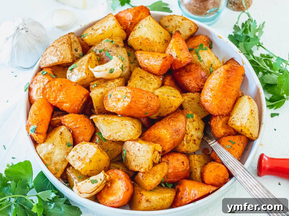 Caramelized Carrots and Crispy Brussels Sprouts 13 A serving of roasted potatoes and carrots, golden brown and seasoned.
