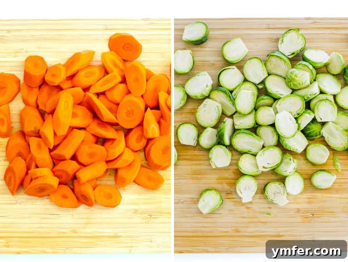 Caramelized Carrots and Crispy Brussels Sprouts 7 Chopped carrots and halved Brussels sprouts arranged on a cutting board.