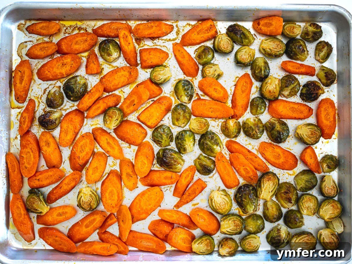 Caramelized Carrots and Crispy Brussels Sprouts 9 Roasted carrots and Brussels sprouts, golden and slightly charred, fresh out of the oven.
