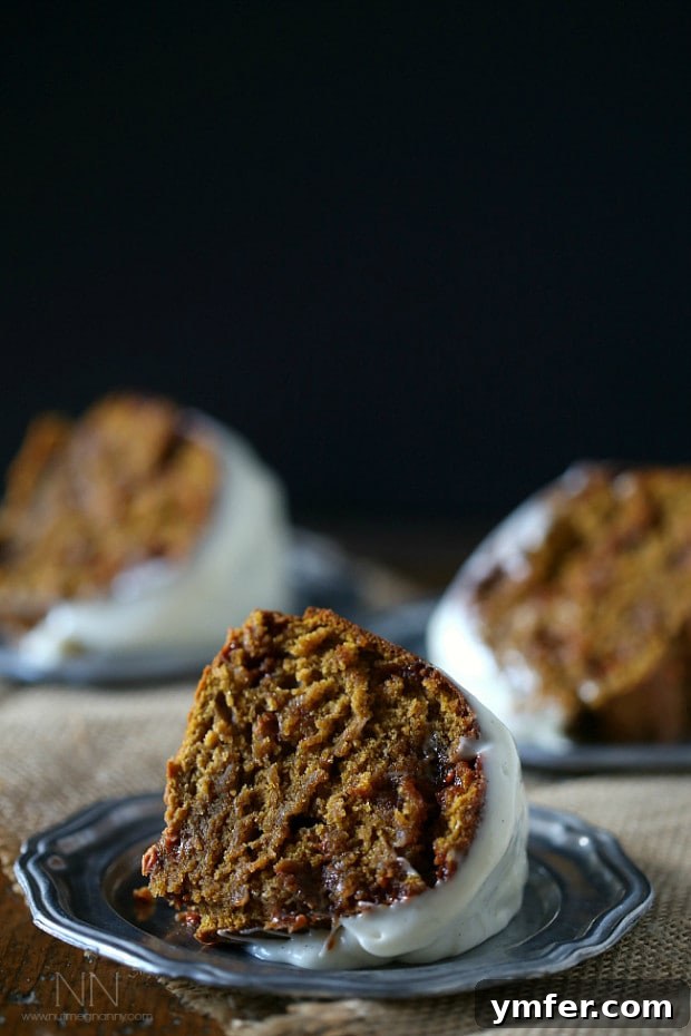 A delicious slice of butterscotch pumpkin bundt cake on a plate. A perfectly portioned slice of Butterscotch Pumpkin Bundt Cake served on a delicate small plate, highlighting its golden-brown crust and inviting interior.