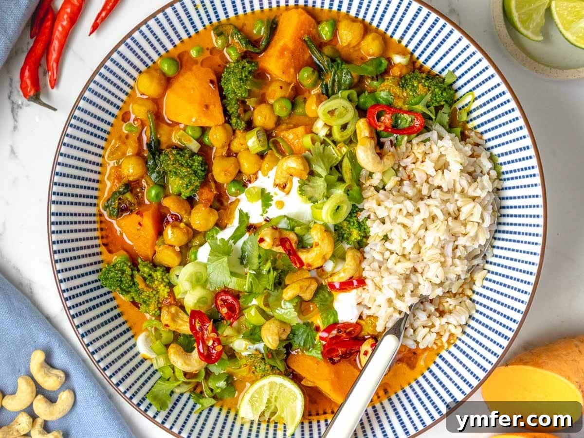 Streamline Your Week with Vegetarian Meal Prep 26 A comforting vegetable curry served in a blue bowl with rice, a flavorful and adaptable meal prep option.