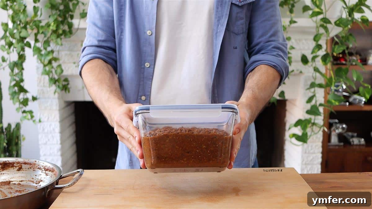 Streamline Your Week with Vegetarian Meal Prep 33 Lentil bolognese sauce stored neatly in a glass container, showcasing efficient meal prep storage.