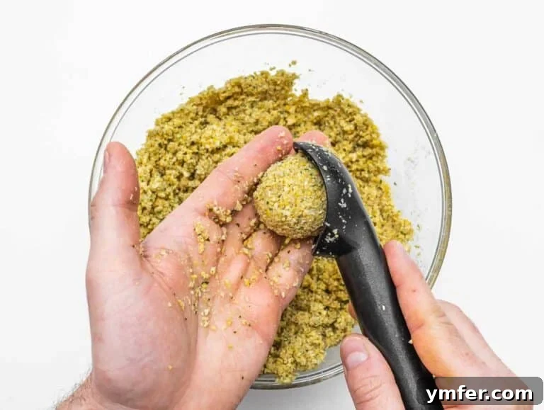 shaping the falafel with ice cream scooper