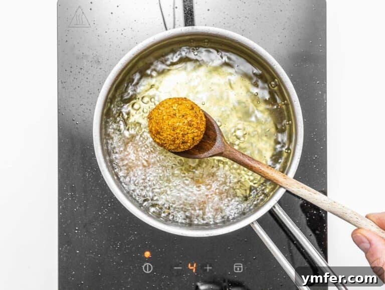 fried falafel and wooden spoon