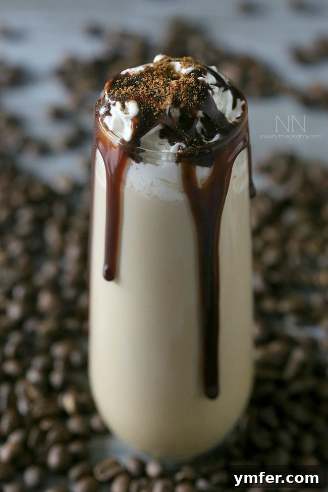 Pumpkin Spice White Russian with chocolate drizzle. An elegantly served Pumpkin Spice White Russian in a glass, garnished with a subtle chocolate drizzle, ready to be enjoyed.