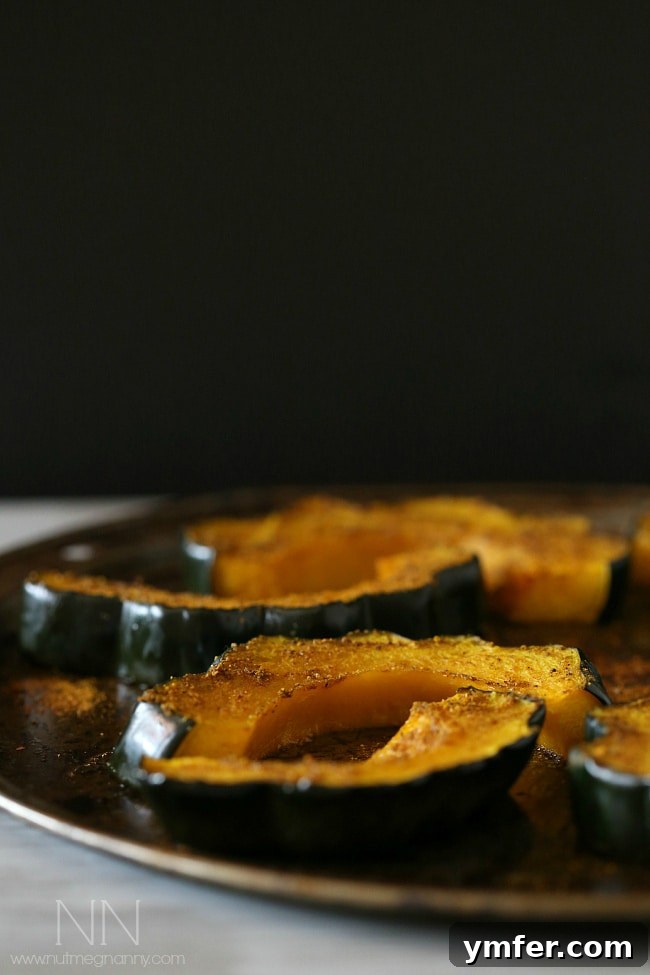 Simple Curry Roasted Acorn Squash Close-up of perfectly roasted curry acorn squash rings, a vibrant and flavorful addition to any meal.