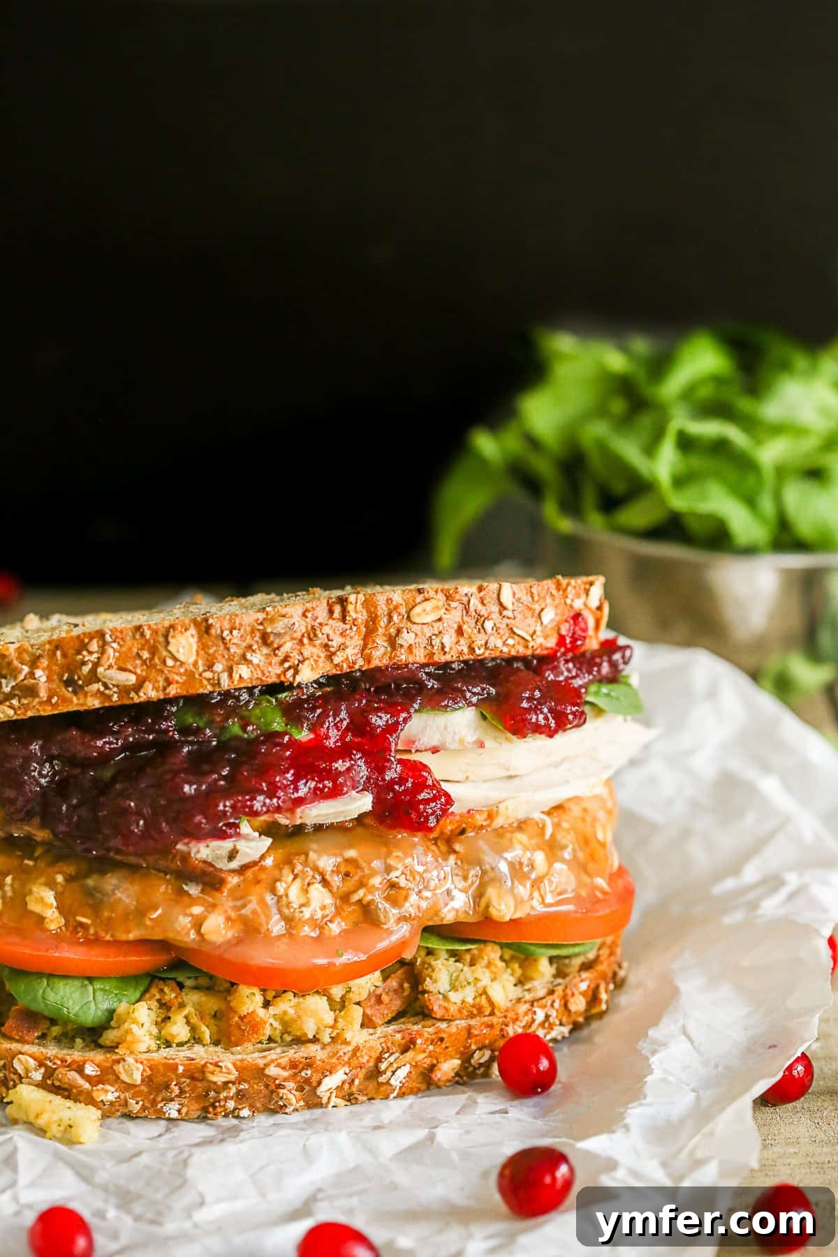 This leftover Thanksgiving sandwich with moist maker is the perfect way to pay homage to your favorite Friends episode. All the taste of a Thanksgiving dinner with a secret gravy soaked moist maker middle! A freshly assembled Leftover Thanksgiving Sandwich, presented on parchment paper, ready to be enjoyed.