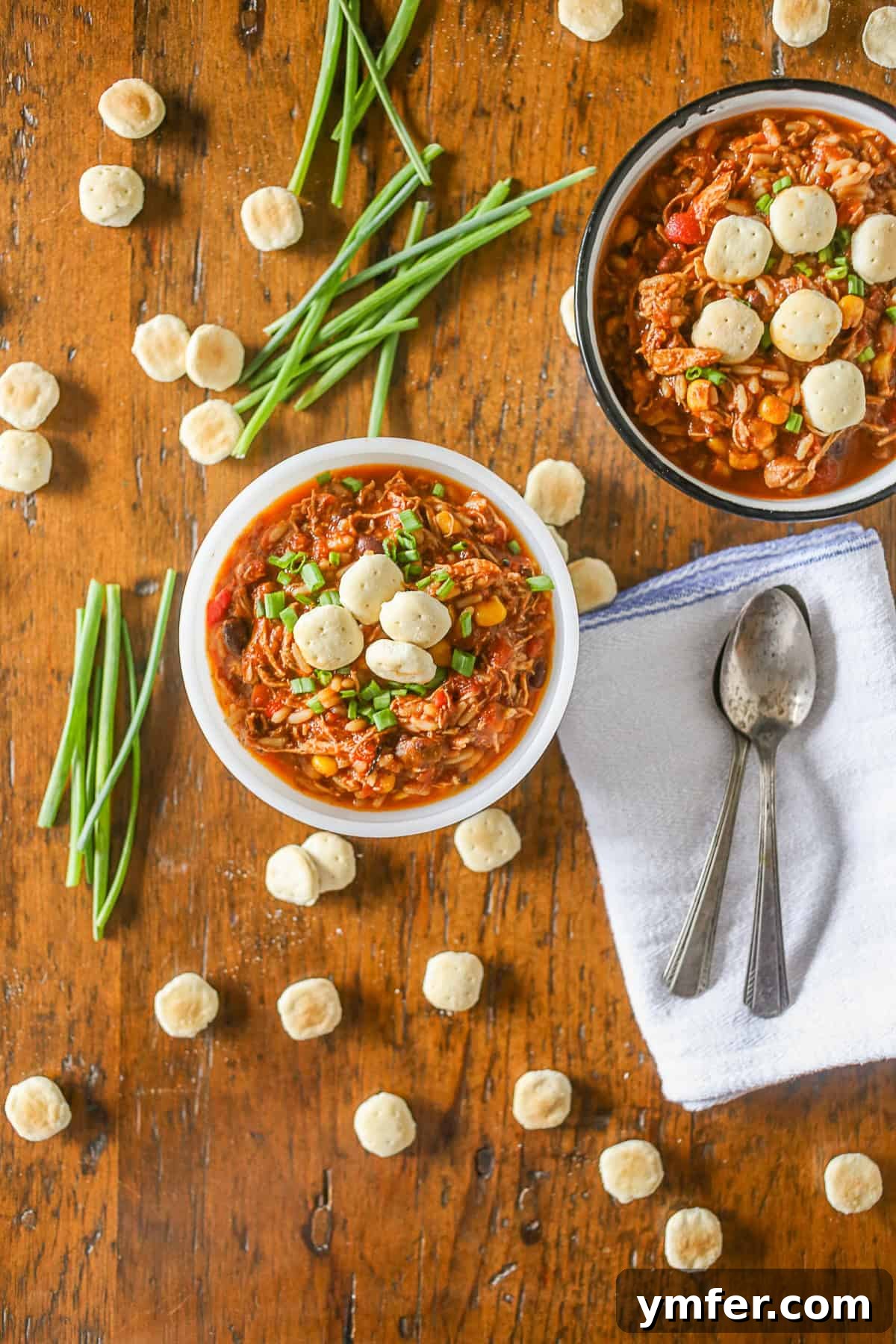 A large pot of rich turkey wild rice chili, perfect for a warming meal, full of savory flavors. A top-down view of a large pot filled with steaming Wild Rice Turkey Chili, ready to be served.