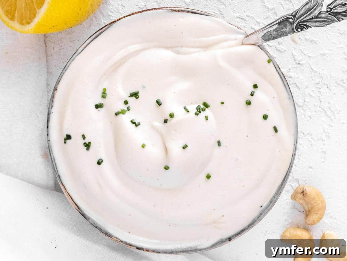 Creamy Vegan Ranch 11 Vegan sour cream garnished with fresh chives, a key ingredient for cashew ranch.
