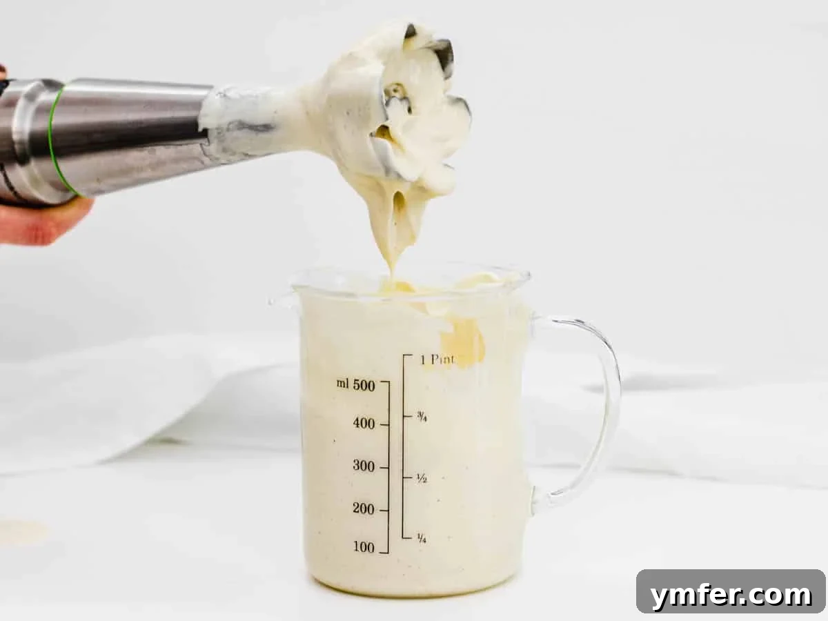 Creamy Vegan Ranch 6 An immersion blender next to a jar, hinting at the ease of making vegan mayo.
