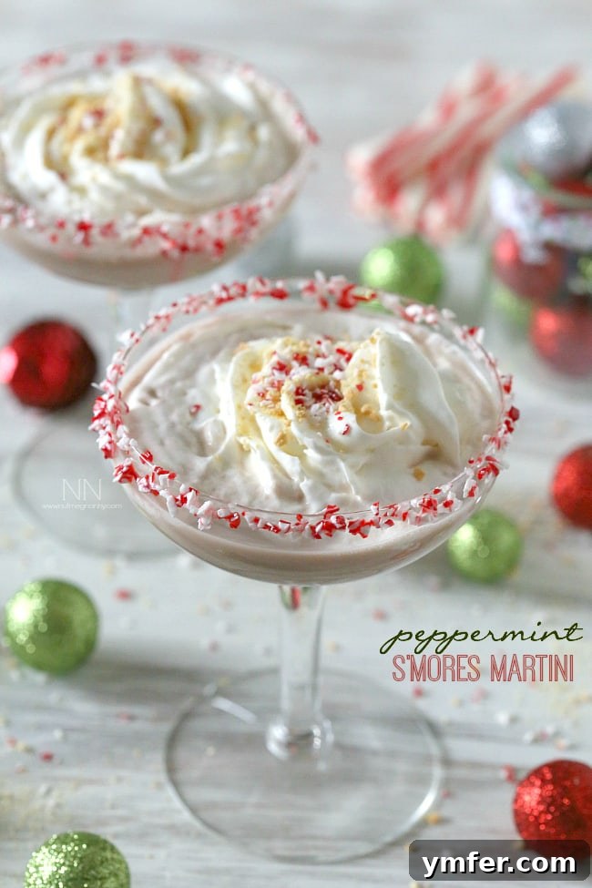 The perfect Peppermint S'mores Martini for holiday cheer Festive Peppermint S'mores Martini with toasted marshmallows and candy cane rim