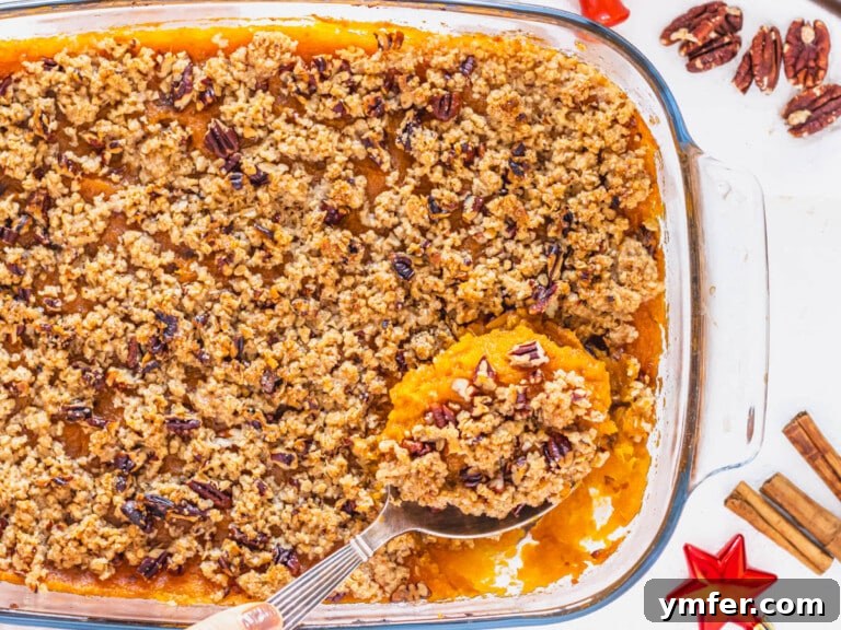 Golden Vegan Sweet Potato Delight 16 vegan sweet potato casserole with a silver spoon