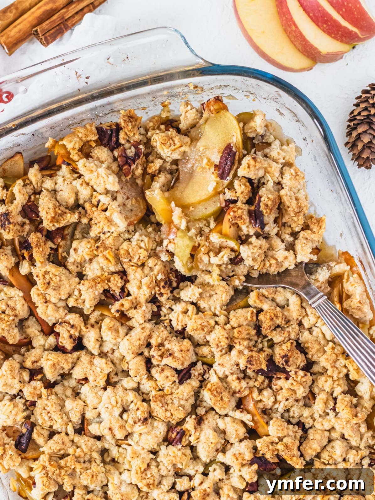 Plant-Based Apple Crumble 2 Vegan apple crisp with silver spoon ready to be served