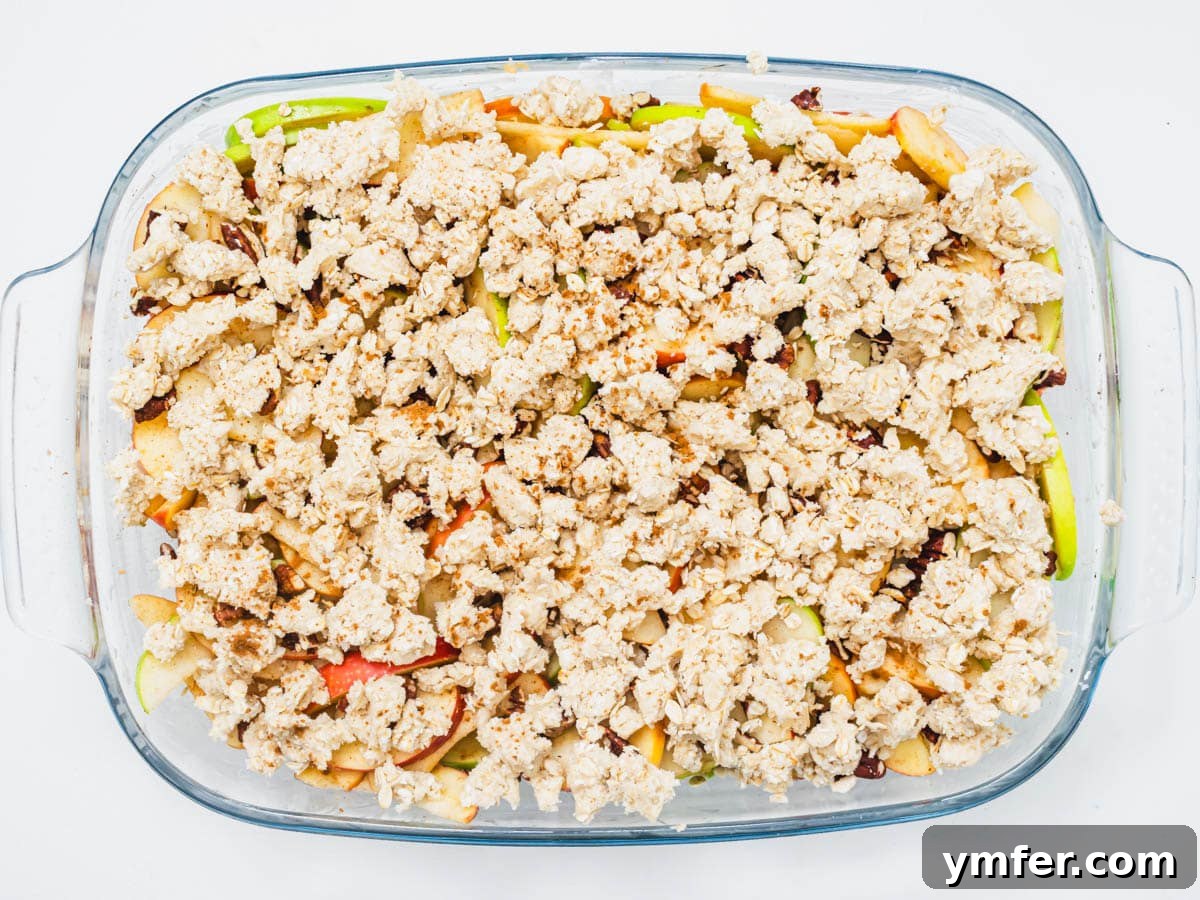 Plant-Based Apple Crumble 11 Vegan apple crisp assembled in a baking dish, ready for the oven