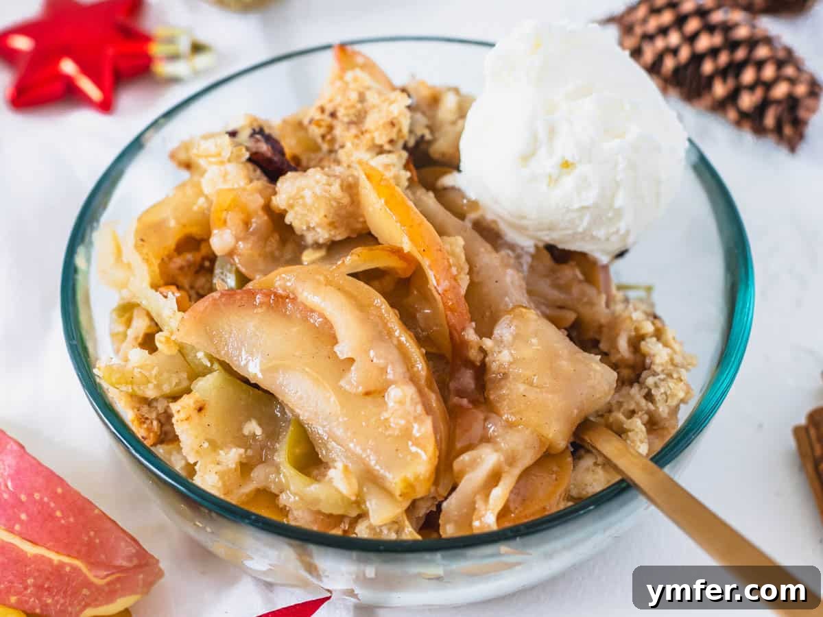 Plant-Based Apple Crumble 3 Vegan apple crisp with ice cream and golden spoon, ready to enjoy