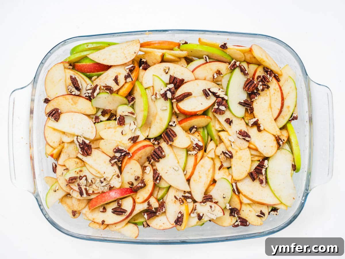 Plant-Based Apple Crumble 8 Apple and pecan mixture neatly arranged in a casserole dish