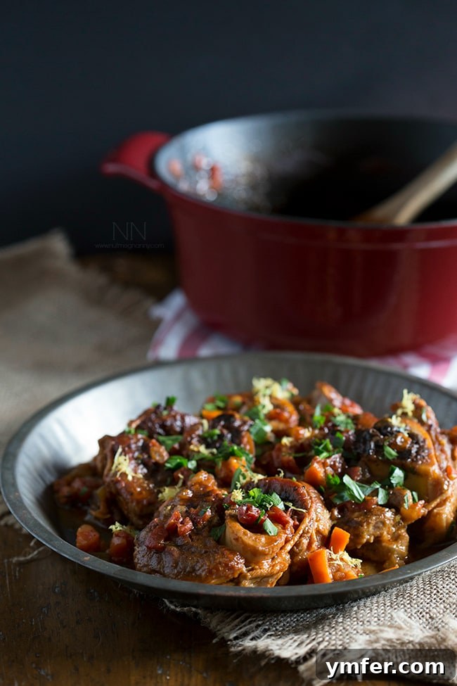 Exquisite Veal Osso Buco, A Hearty and Flavorful Holiday Tradition Close-up of a perfectly braised Veal Osso Buco, garnished with fresh herbs and lemon zest, ready to be served as a gourmet holiday centerpiece.