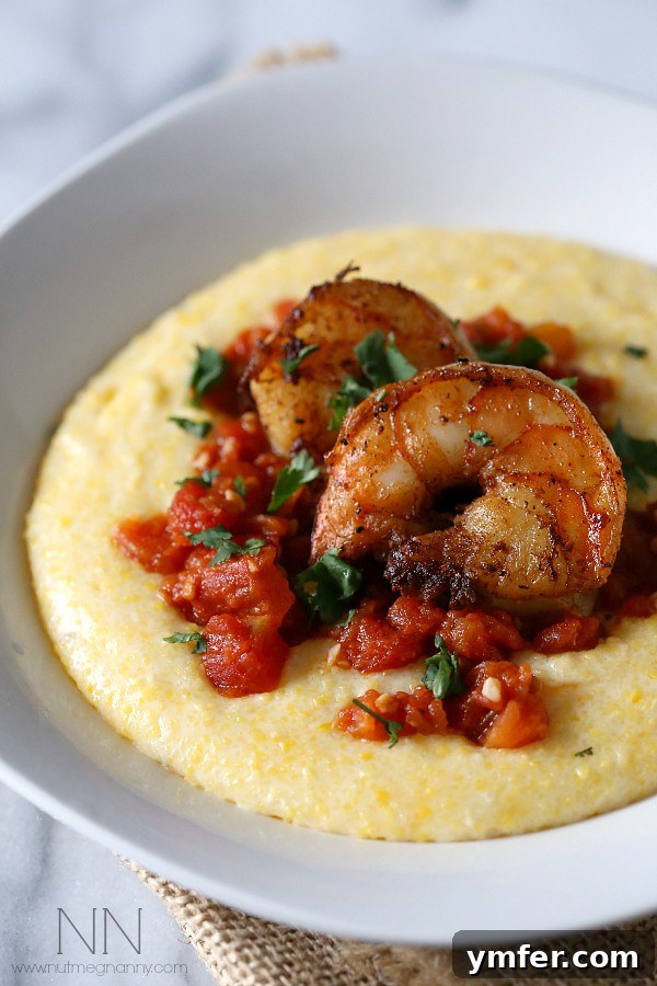 Spicy Shrimp with Creamy Polenta Dinner Idea Succulent spicy shrimp served atop a generous bed of golden, creamy polenta, garnished with fresh parsley, creating a vibrant, flavorful, and comforting seafood dish.